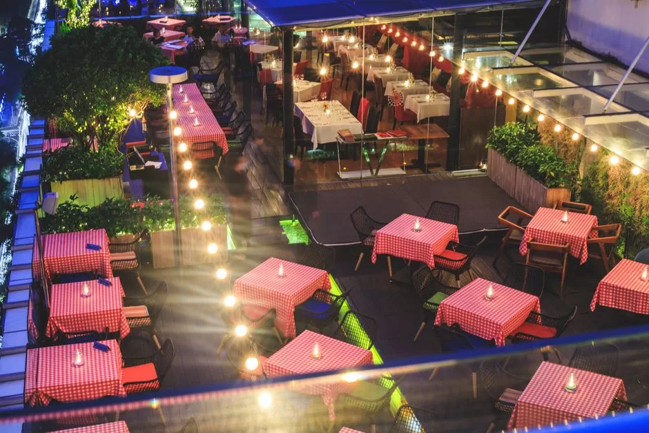 A rooftop terrace laid for dinner