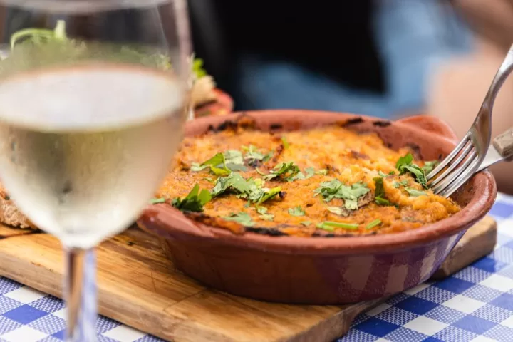 Close up of person eating a dish in a restaurant