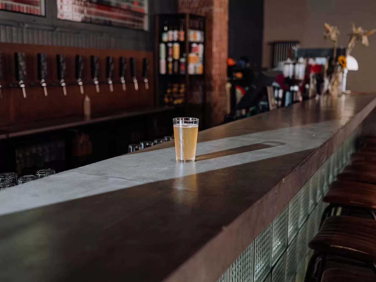 A brewery taproom with steel tanks