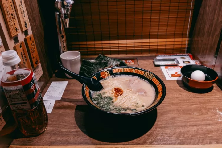 A bowl of ramen on a counter