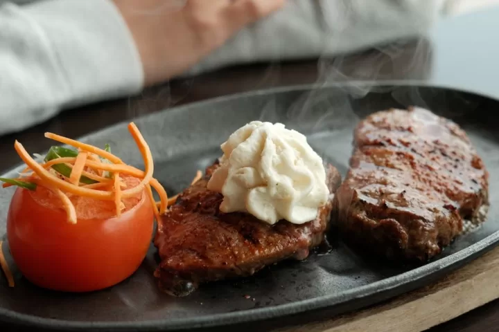 Delicious steak and tomato dish with whipped butter