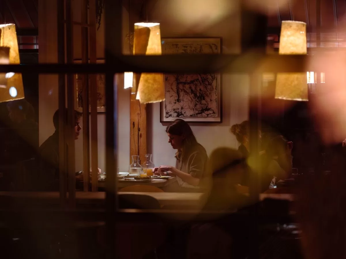 A couple at a candlelit restaurant table