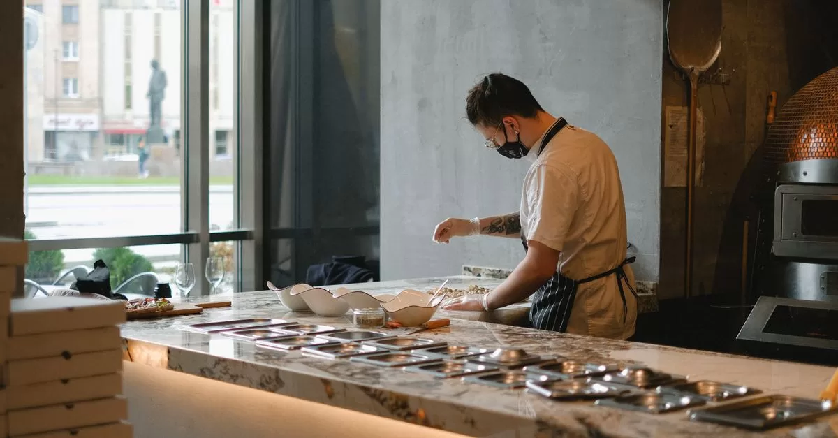 Cook working in pizzeria