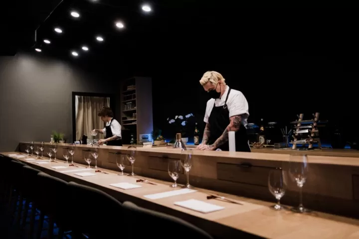 Men standing near the bar counter