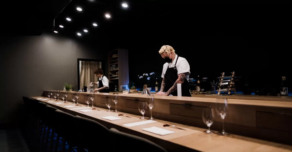 Men standing near the bar counter