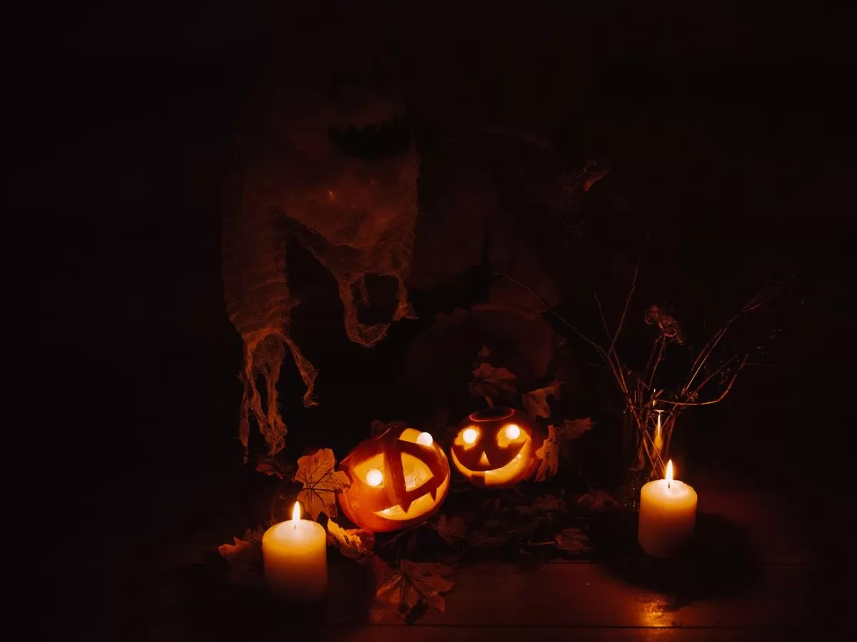 Carved pumpkins glowing in the dark