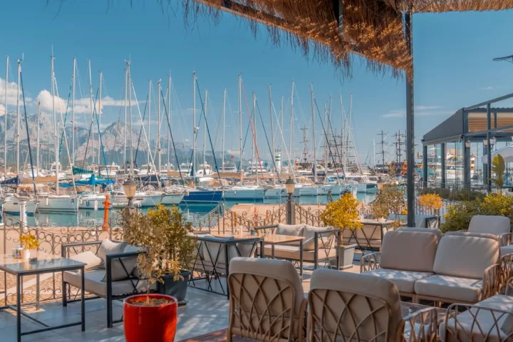 Seats on patio of restaurant near marina in antalya turkey