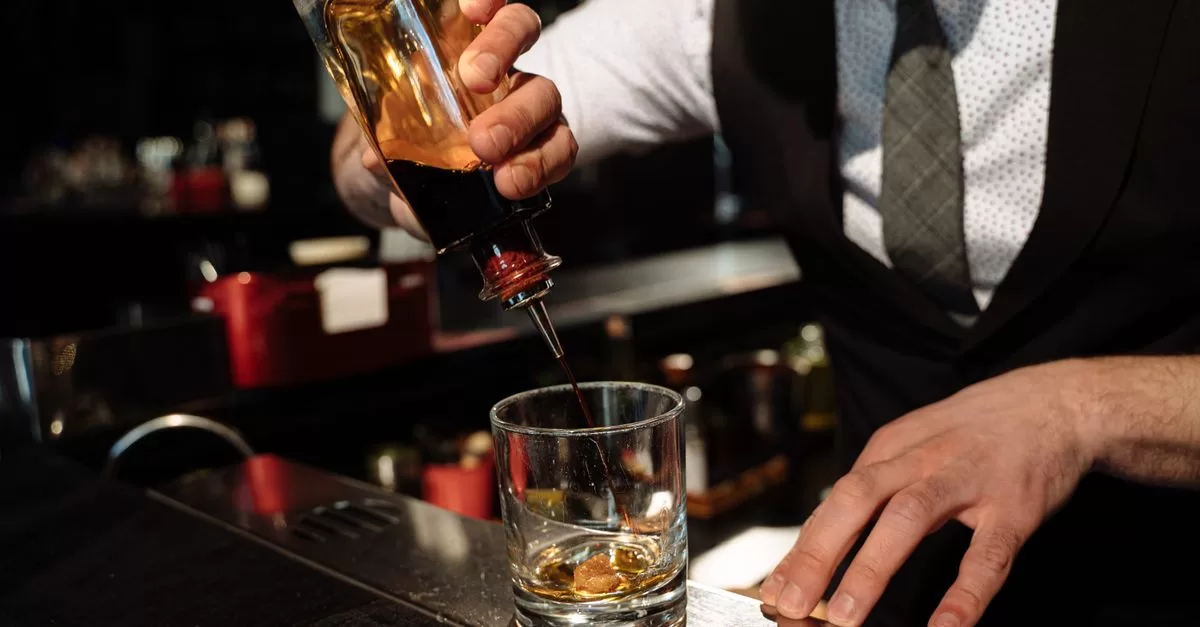A bartender making a cocktail