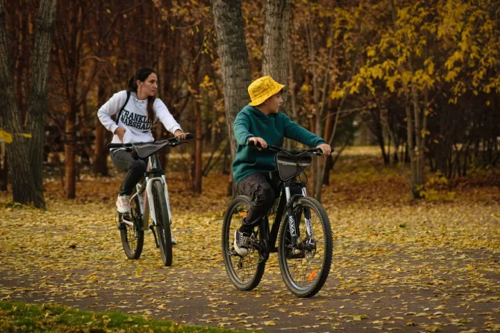 Cyclists riding together in a park