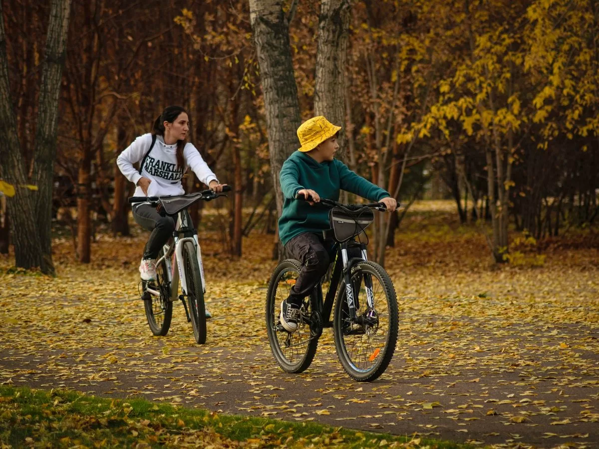 Cyclists riding together in a park