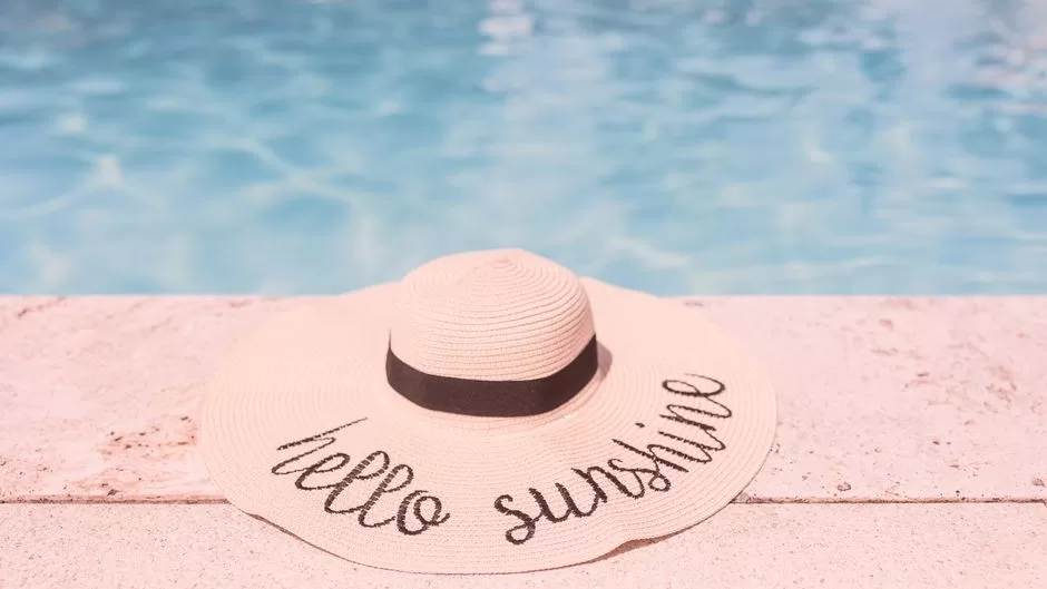 An outdoor swimming pool on a summer day