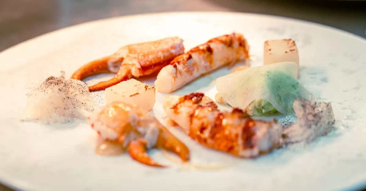 A white plate topped with food on it