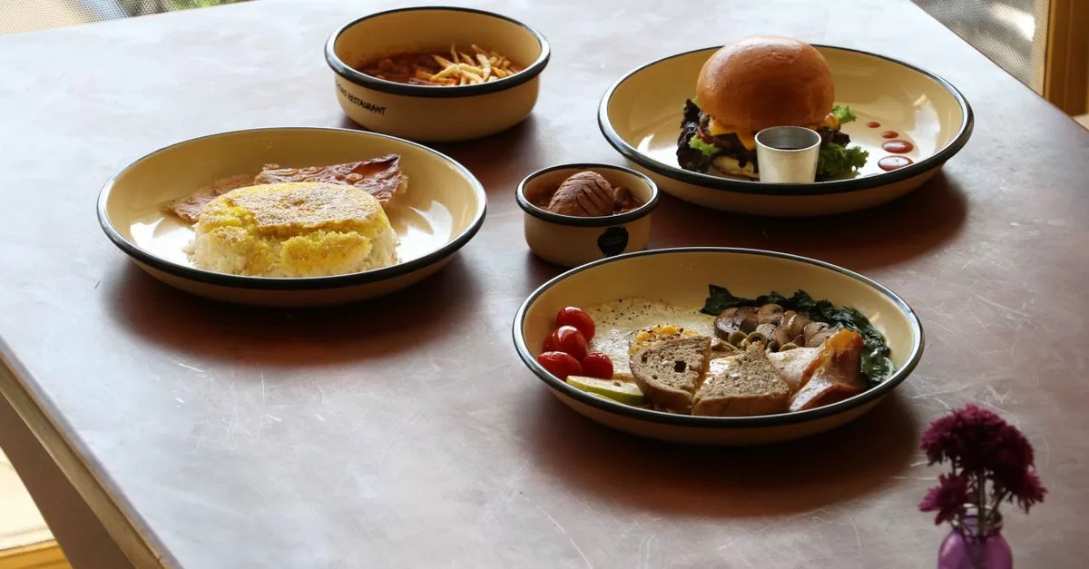 Plates of food on a restaurant table