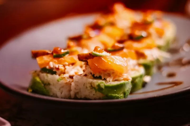 Delicious sushi rolls with salmon and avocado