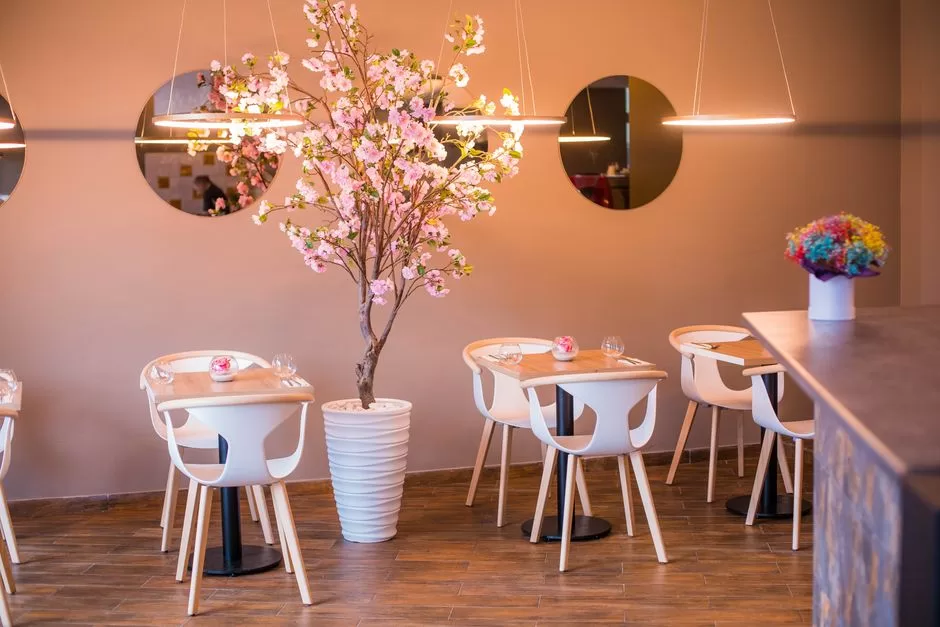 A dining room hung with blossom
